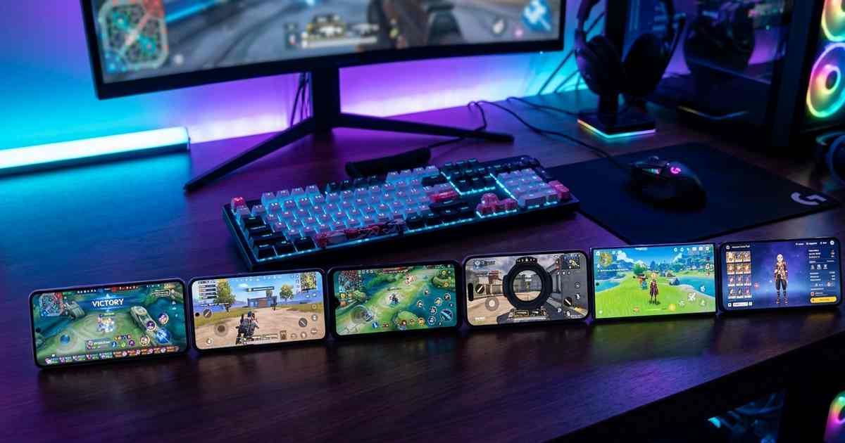 Deretan HP gaming 2026 terbaik di bawah Rp5 juta dengan layar menampilkan game Mobile Legends dan PUBG di atas meja gaming ber-RGB